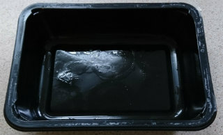 Black plastic try on countertop