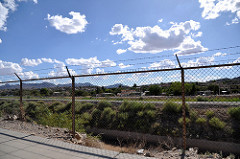 Chain link fence with barbed wire on top