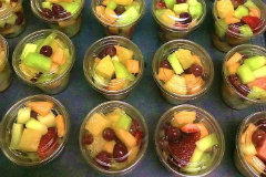 cut up fruit in clear plastic containers