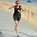 Older woman jogging by the ocean