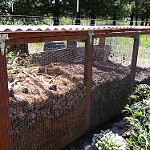 Wooden compost structure with three compartments